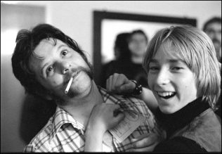 John B. Sparks ('Sparko') of Dr Feelgood with a fan in the dressing room at Malvern Winter Gardens, 20 May 1977 | David Corio